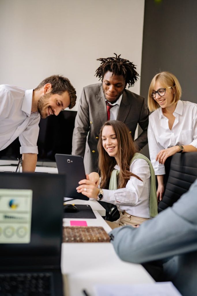colleagues-working-and-planning-inside-an-office-7793688 A diverse office team collaborates with technology in a modern workplace.